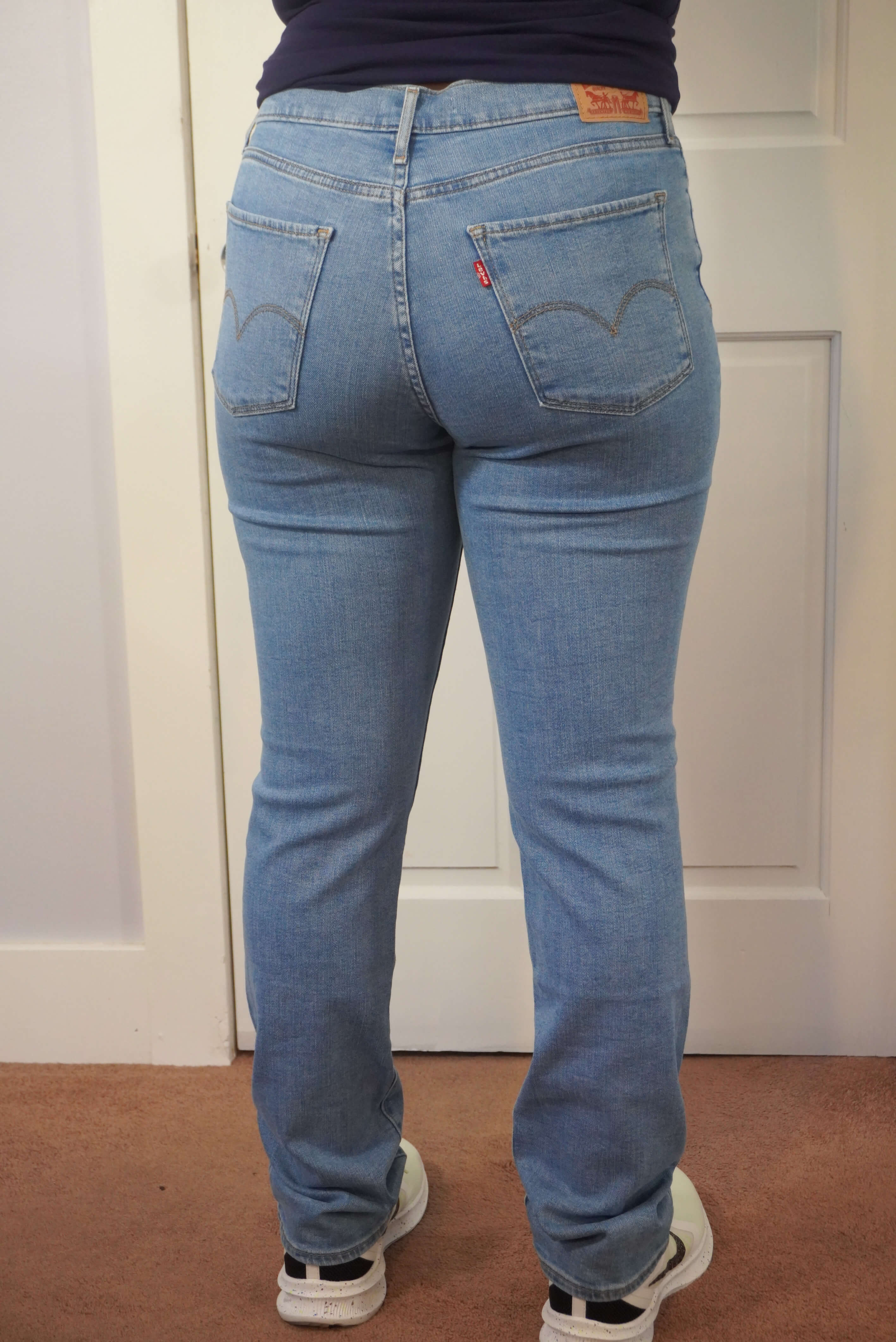 This image shows a back view of the Levi's 724 jeans. The back pockets and waistline fit are displayed.