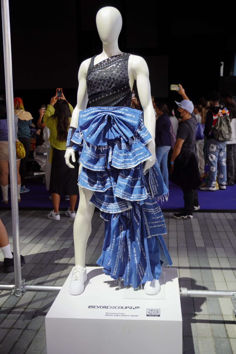 Image of look showcasing a mesh top with blue ruffled pant