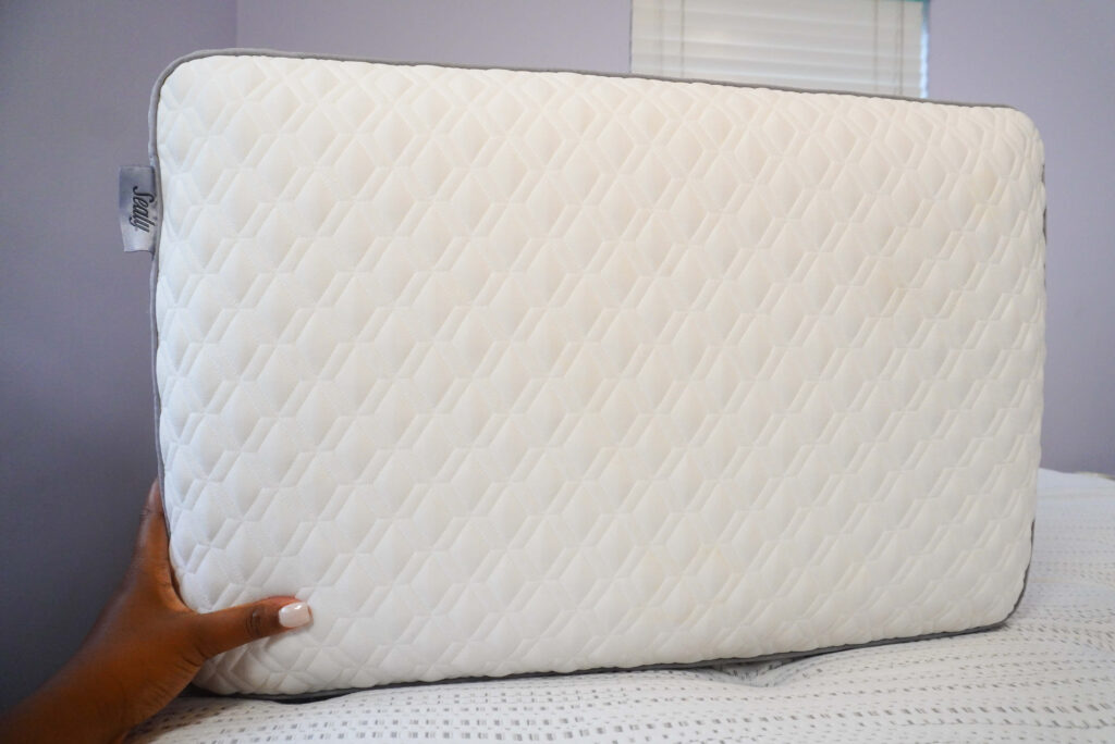 Image of the Sealy pillow up close. The pillow is white with diamond shaped quilting.