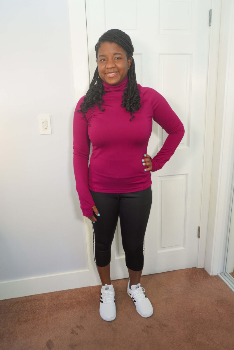 Image of me wearing Adidas shoes with cropped black leggings and a hot pink long sleeve training top.