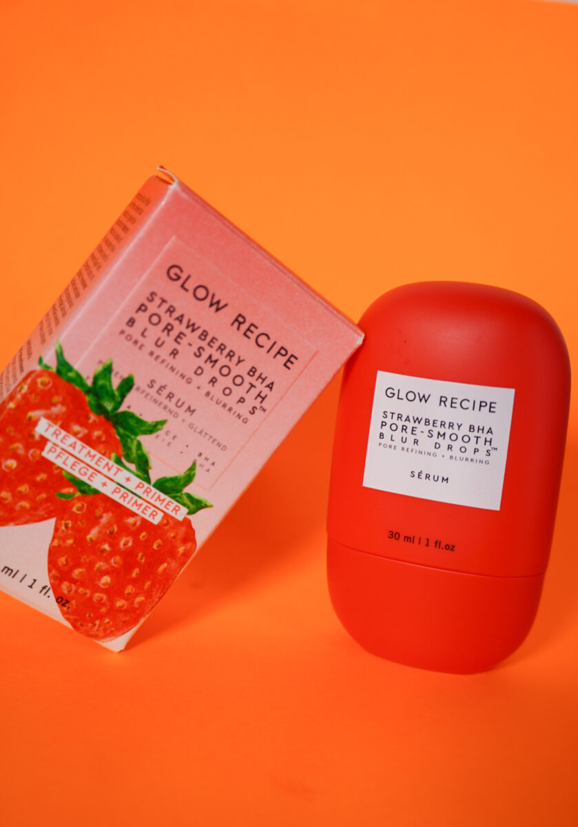 Image of the Glow Recipe Strawberry Blur Drops on the right in the red bottle with the packaging box on the left. 