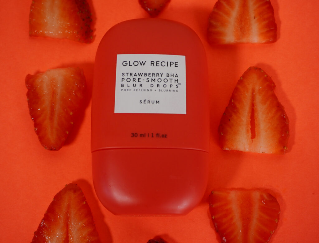 Image of Glow Recipe Strawberry Blur Drops up close surrounded by strawberries.