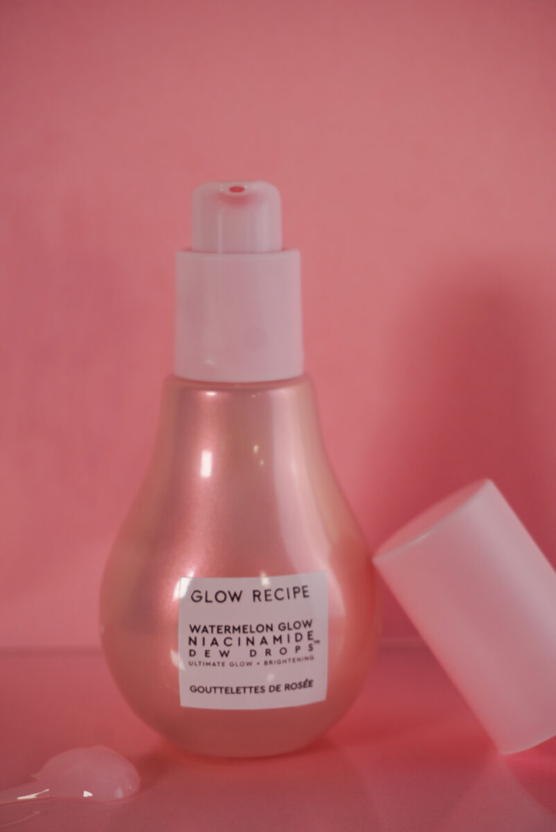 Image of Glow Recipe Dew Drops bottle with the serum sitting on the side.