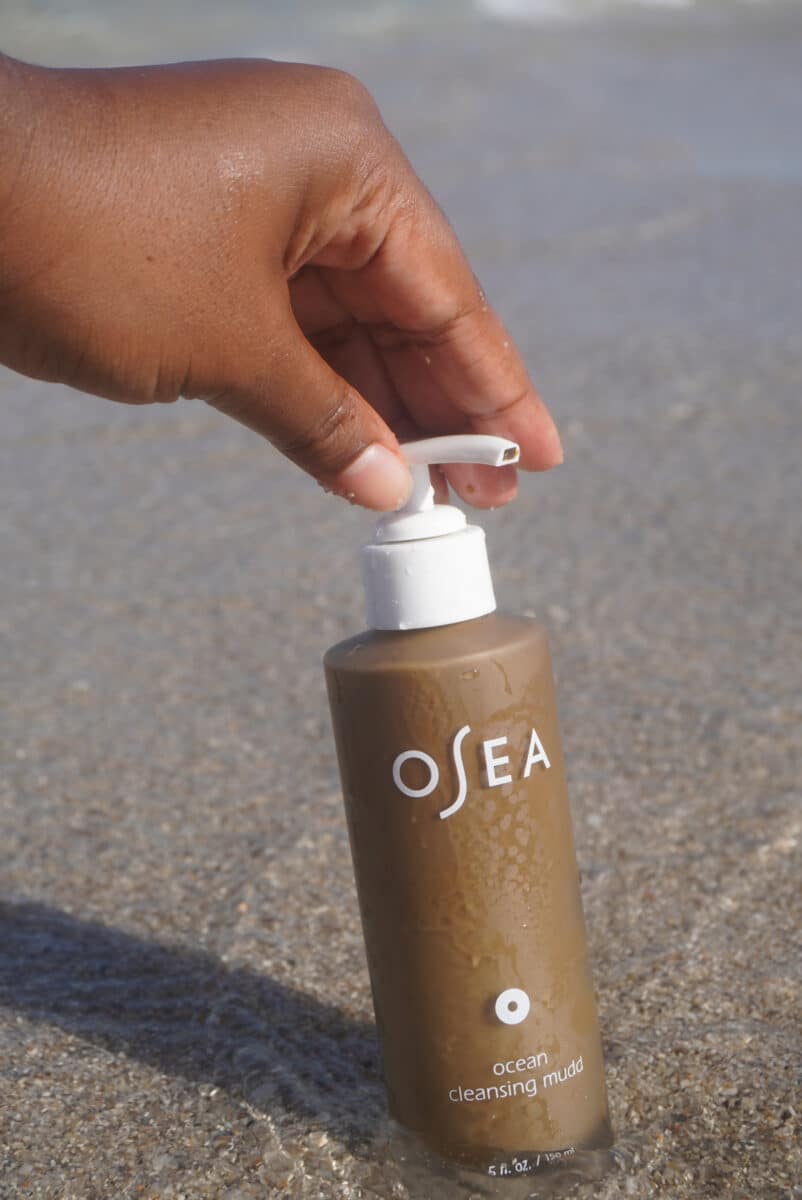 Image of the OSEA facial cleanser in the ocean water.