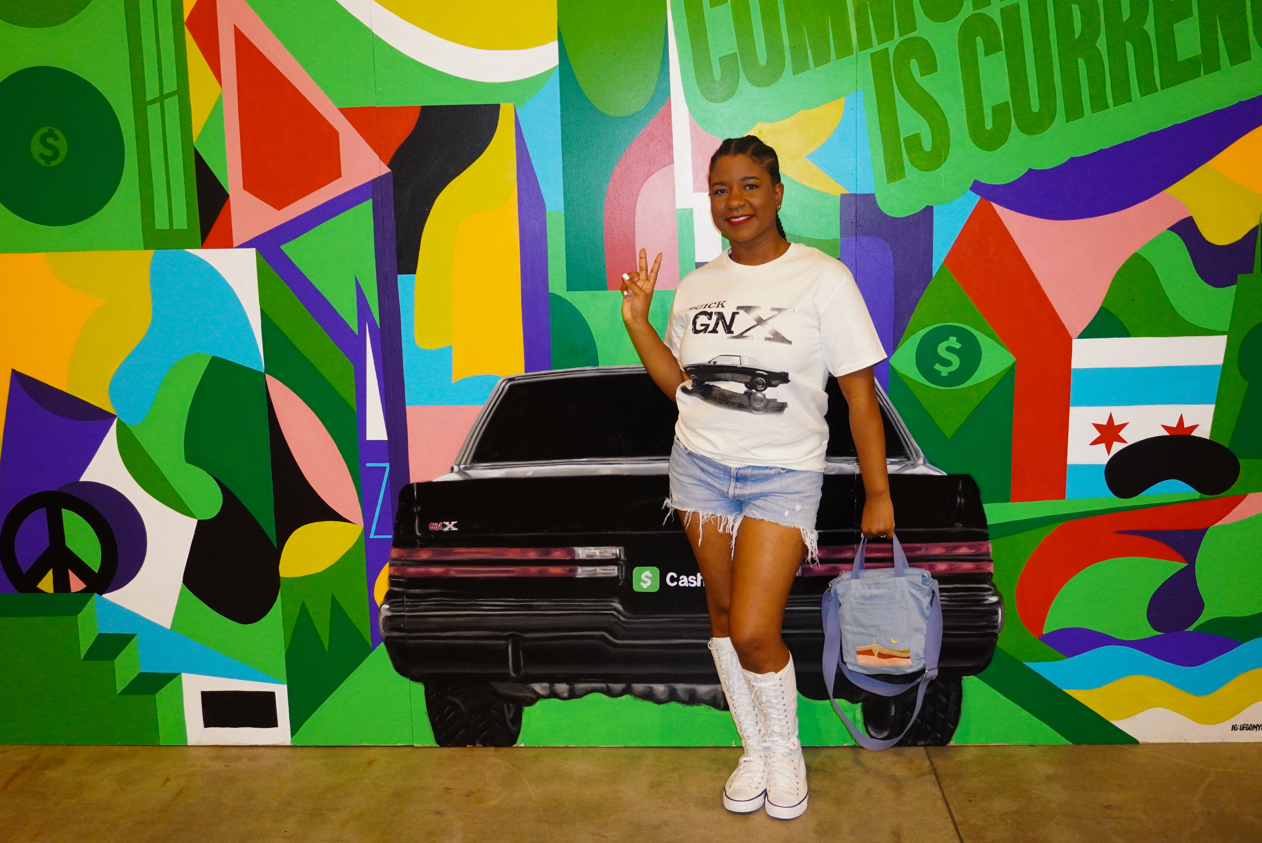 Image of me posing with the peace sign at the Cash App booth at the Kendrick Lamar GNX Tour