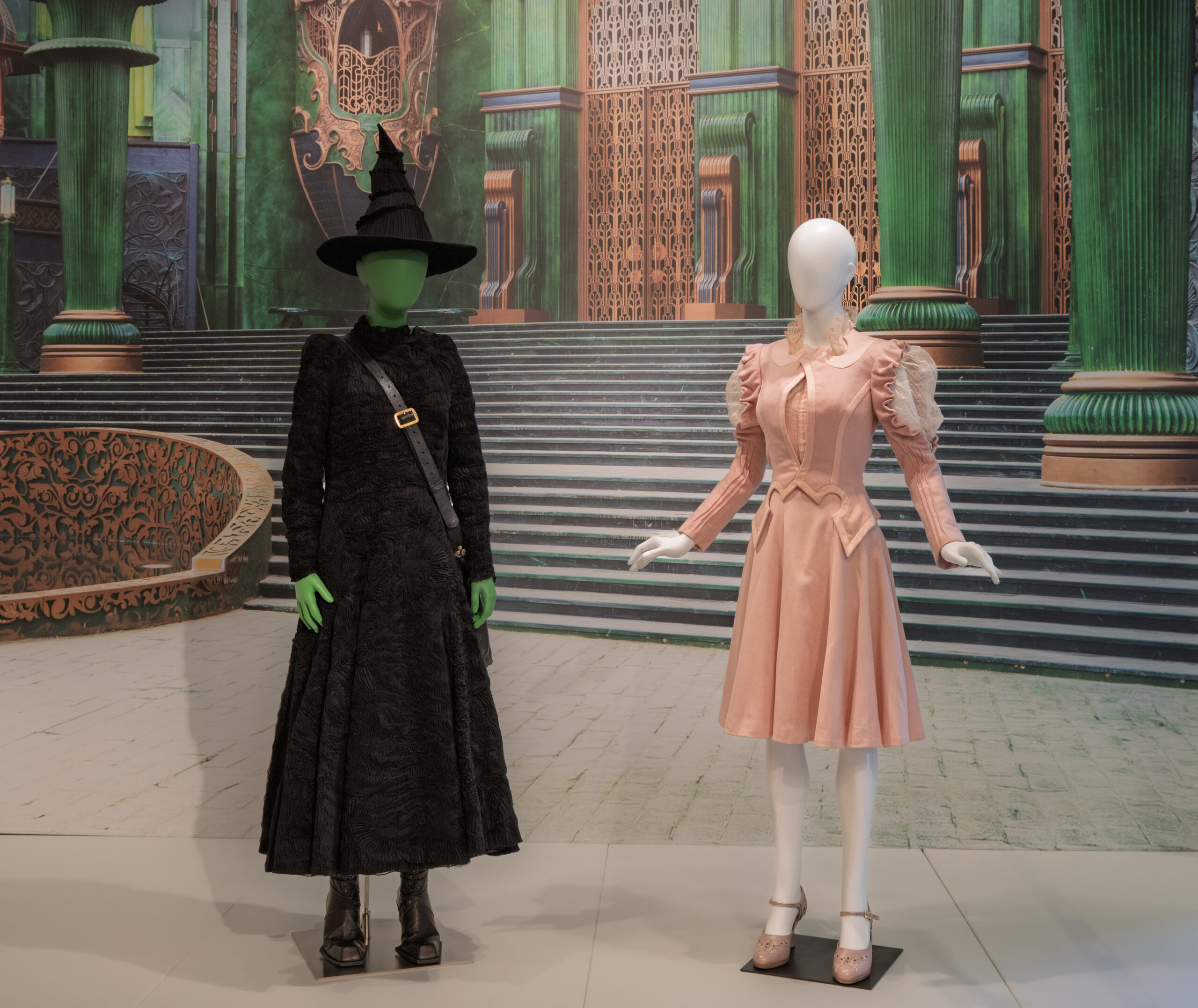 Image of the Wicked costumes from the first film on display at Kent State Museum.