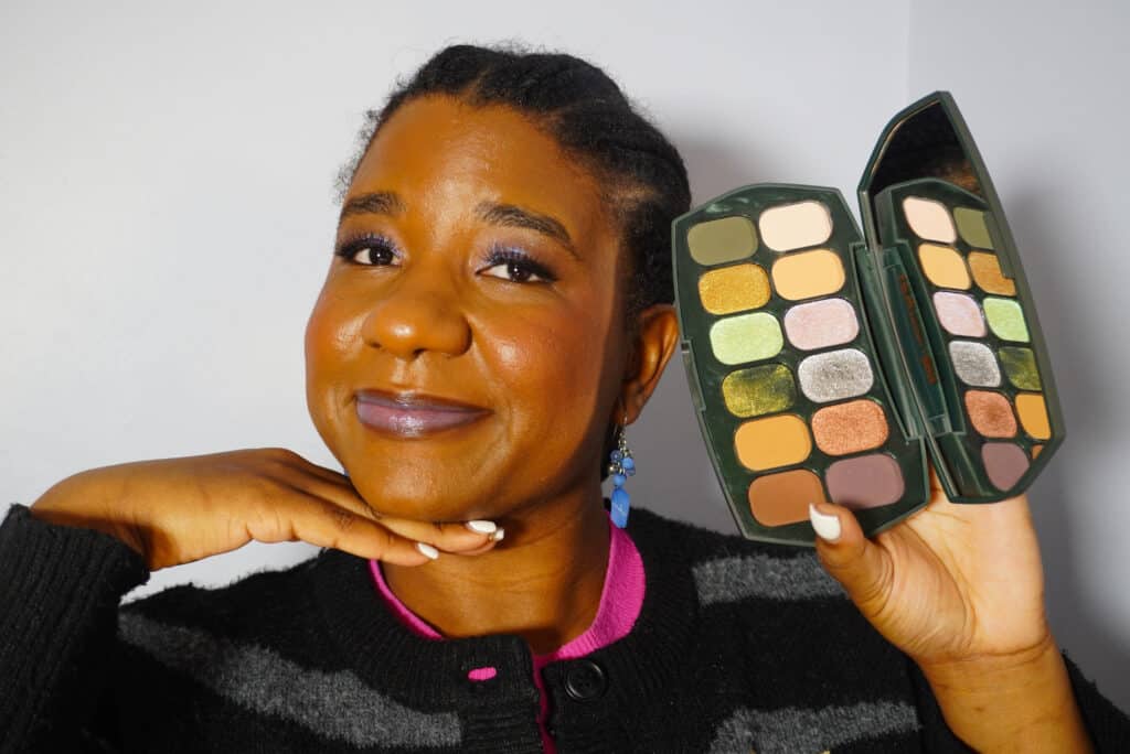 Image of me holding the Wicked x R.E.M. Beauty Ozian Forest Eyeshadow palette.